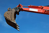 Raised scoop of an earth mover