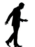 one business man walking looking down silhouette