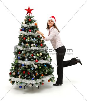 Woman standing near decorated Christmas tree