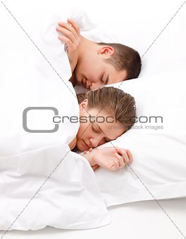 Man and women sleeping in bed