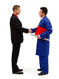 Business man shaking hands with engineer