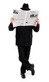 Man in black covering himself with newspaper