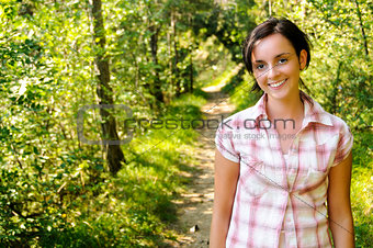 Young Caucasian girl on a hiking path