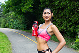 Fit young woman with water bottle after running