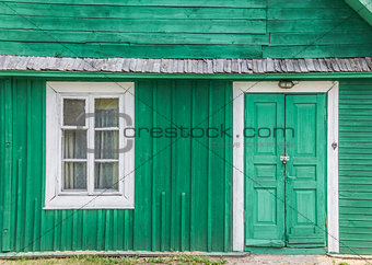 Detail of a traditional green wooden house in Trakai
