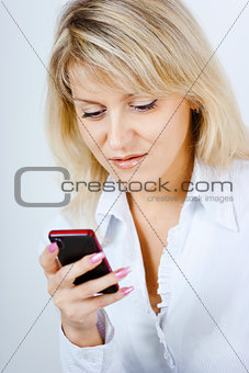 portrait of blonde girl with mobile phone