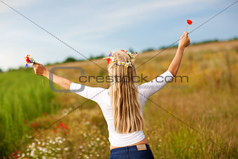girl with flowers on the field