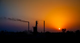 Sun set in industrial area