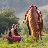 Young girl with a horse