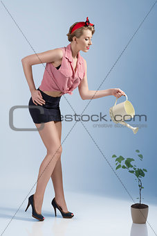 sensual female gardener in summer time 