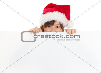 Asian girl in Santa peeking over paper sign board