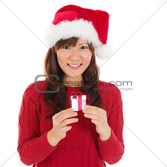 Santa hat Christmas woman holding Christmas gift