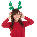 Asian Christmas woman wearing reindeer horns.