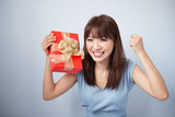 Happy Asian Girl Holding Gift Box