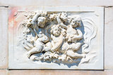 Bas-relief marble sculpture with babies