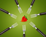 one strawberry between set of forks