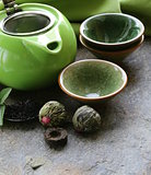 set for a traditional tea drinking (teapot, cups and green tea)