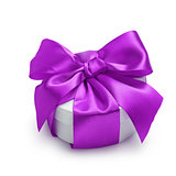 cylinder gift box with ornate ribbon bow