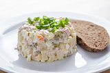 russian salad olivier served with onion