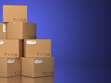 Pile of cardboard boxes on a blue background.