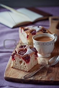 Raspberry cake and a cup of coffee