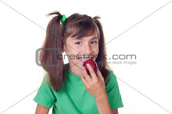 A little girl eating plum 