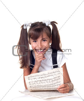Cute little girl with books. School portrait.