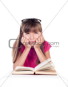 Little tired student girl with books