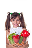 beautiful little girl with vegetables 
