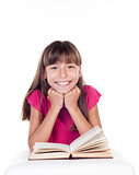 Cute little girl with books. School portrait. 