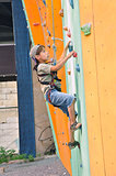 child climbing up the wall