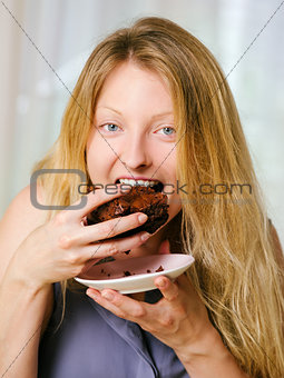 Female eating a brownie