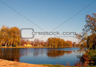 Autumn landscape with river and forest