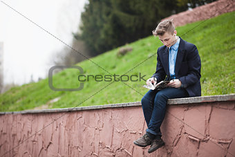 Young man siting with book