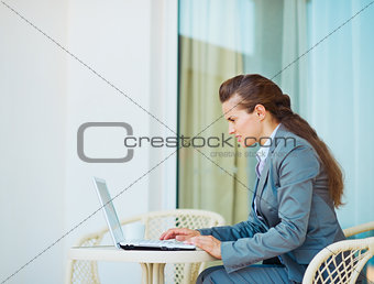 Business woman working laptop on terrace