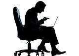 one business man computer computing sitting in armchair silhouet