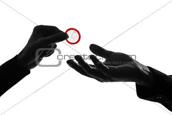  couple man and woman hands holding giving condom close up