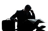 silhouette man despair full length sitting reading newspaper 