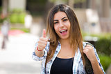 Mixed Race Female Student on School Campus with Thumbs Up