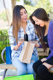 Young Adult Mixed Race Women Looking Into Their Shopping Bags