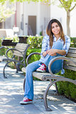 Mixed Race Female Student Portrait on School Campus Bench