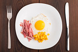 Fried egg with ham and corn