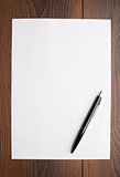 Blank sheet of white paper and pen