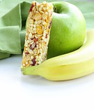 granola bar, green apple and banana - healthy eating