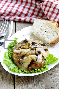pork steak with mushroom sauce on a white plate
