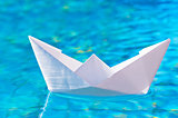 paper boat on the water in the pool
