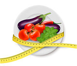 Diet meal. Vegetables in a plate with measuring tape. Concept of
