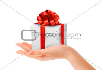 Gift box in hand with red bow and ribbons. Vector. 