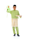 indonesian male with ketupat during ramadan festival with isolat
