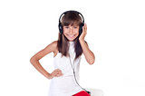 Beautiful cute happy little girl with headphones